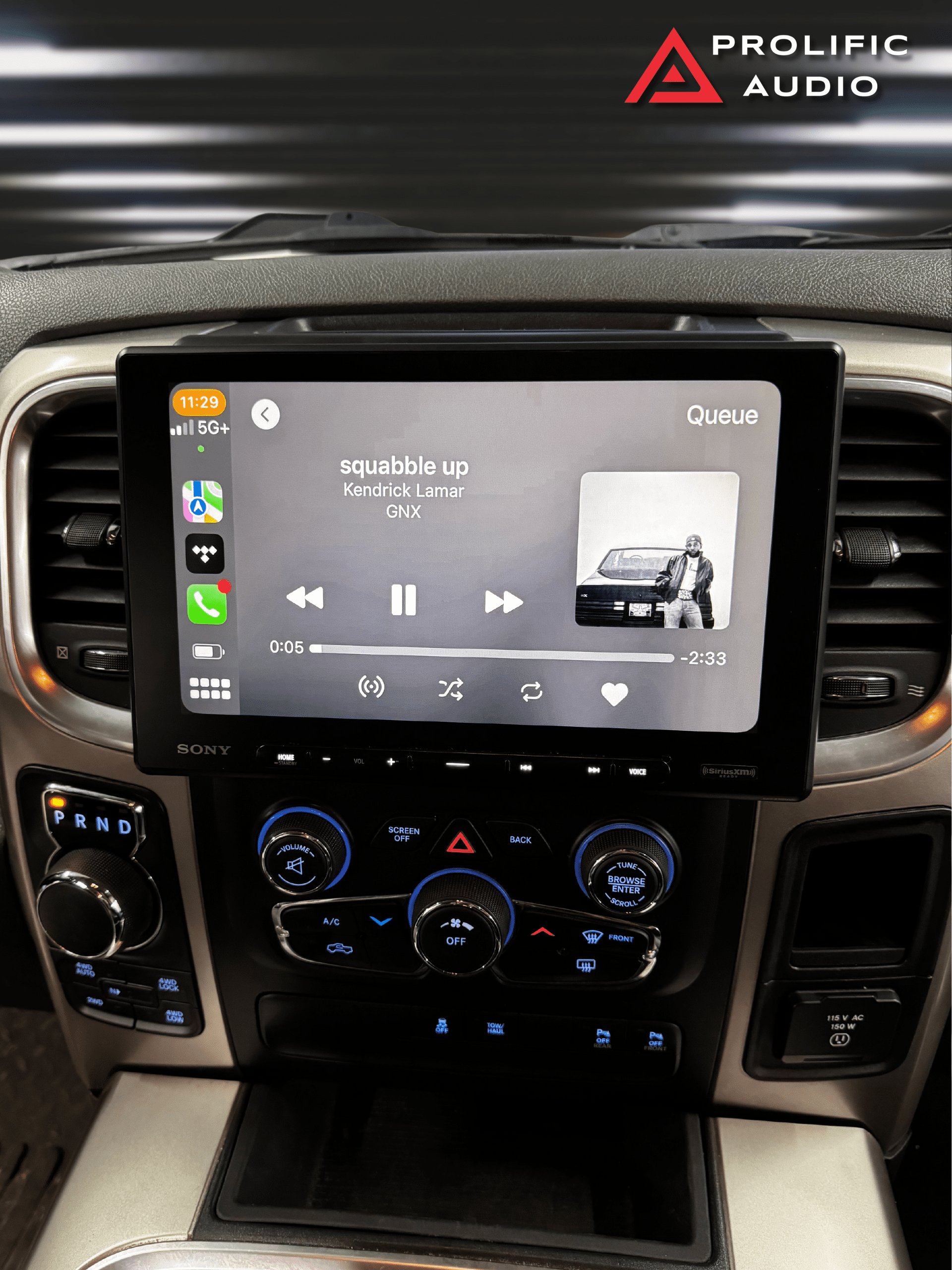 Car stereo display showing music playback of Kendrick Lamar's song 'Squabble Up' with artist details and controls.